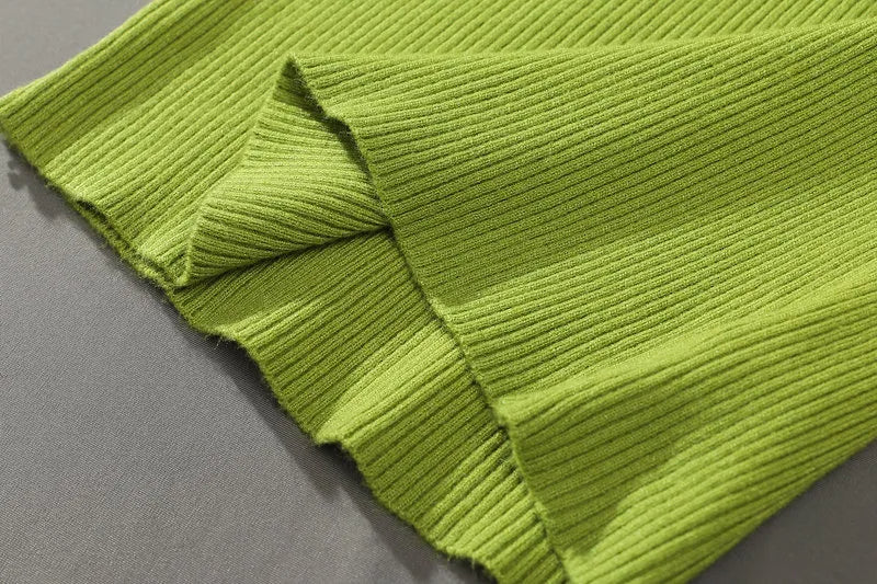 Lime green ribbed knit turtleneck sweater with folded sleeve seam detail