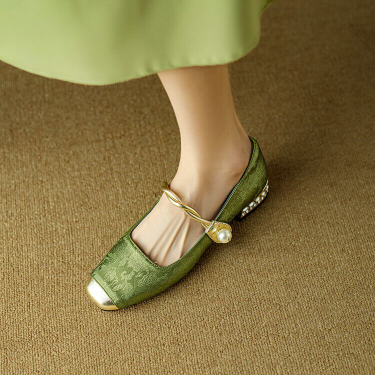 Green Mary Jane flat shoes with twisted strap and pearl button detail, low block heel