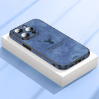 Deer leather iPhone case in blue on a box, showing camera cutouts and side ports.