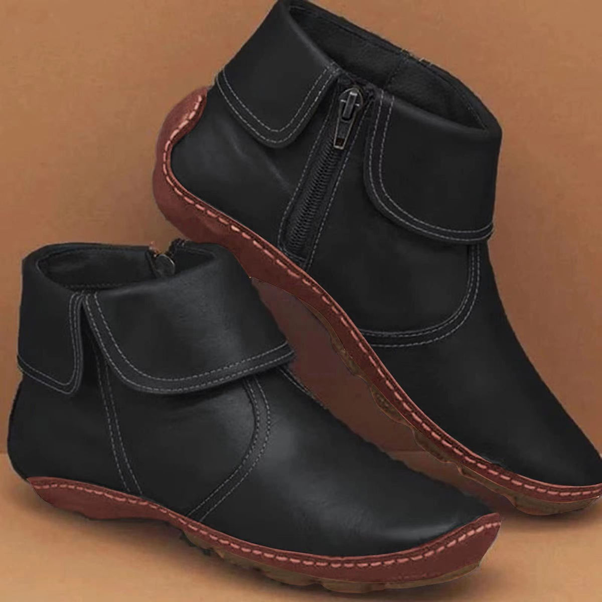 Women’s vintage-style ankle boots, black with contrast gray stitching and side zipper.