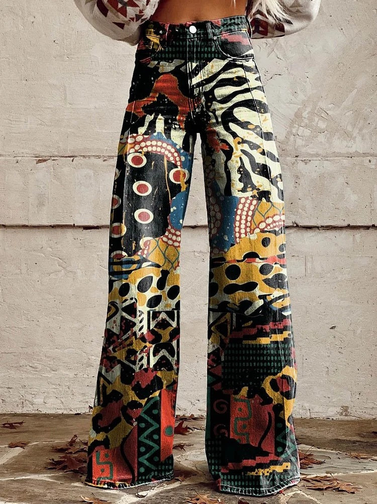 High-waist wide-leg pants with abstract collage print in black, zebra, and red accents