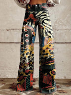 High-waist wide-leg pants with abstract collage print in black, zebra, and red accents