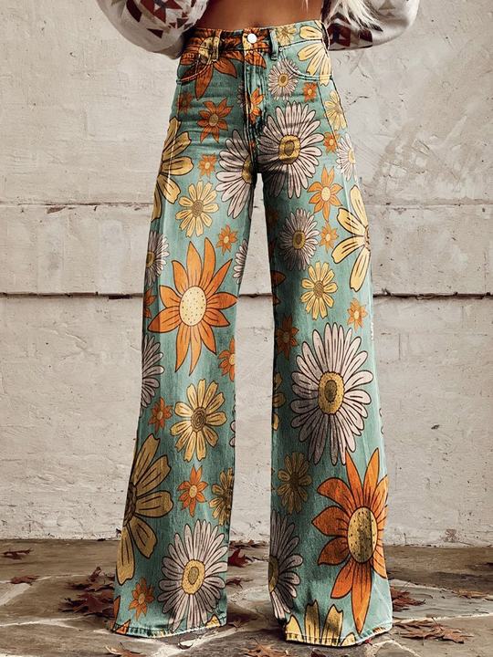 High-waist wide-leg pants with large daisy-style floral print in teal and orange
