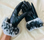 Dark leather gloves with fluffy light gray faux fur cuffs and quilted palm texture.