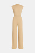 Women's sleeveless wide-leg jumpsuit in beige, high neck and long wide legs.