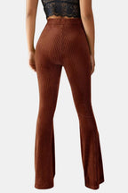 Brown flared corduroy trousers with vertical rib texture and back seam detail