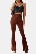 Brown flared corduroy trousers with slit pockets and wide flare legs