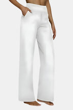 High-waist stretch pants in white with straight-leg fit and side pockets