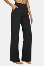 High-waist stretch pants in black with straight-leg fit and side pockets