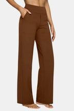 High-waist stretch pants in dark brown with straight-leg fit and side pockets
