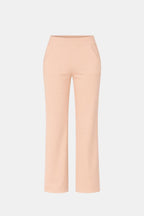 High-waist stretch straight-leg pants in light peach with smooth waistband and seams