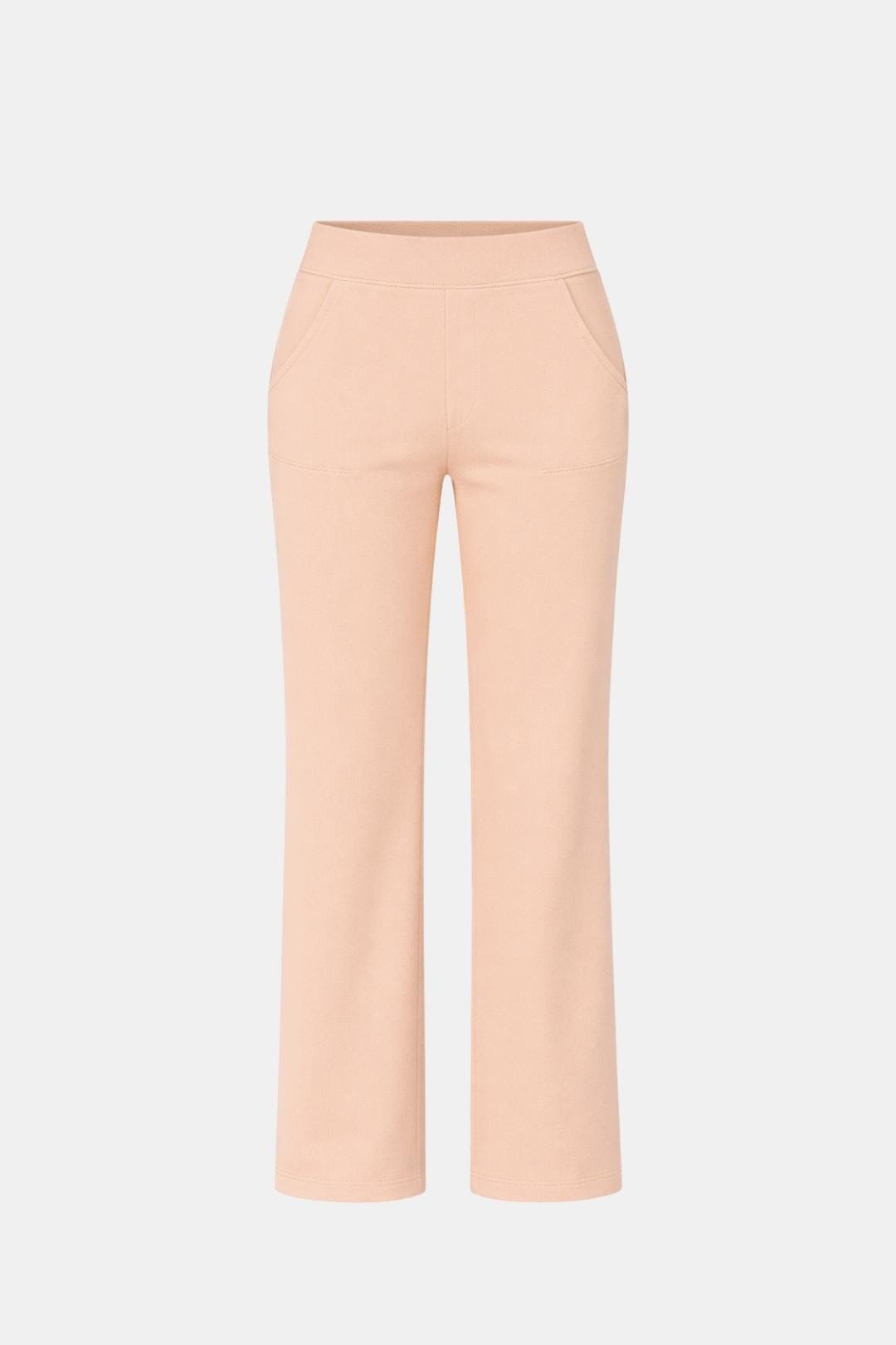 High-waist stretch straight-leg pants in light peach with smooth waistband and seams
