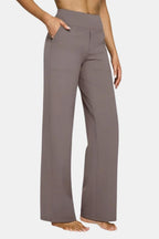 High-waist stretch pants in taupe with straight-leg fit and side pockets