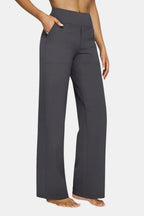 High-waist stretch pants in dark gray with straight-leg fit and side pockets