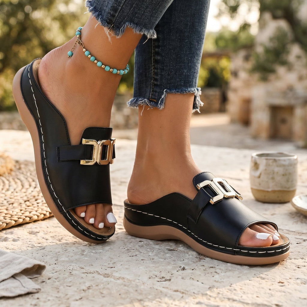 Black open-toe sandals with gold-tone square buckle and thick stitched sole