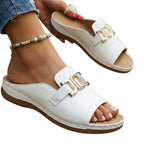 White open-toe sandals with gold-tone square buckle and padded midsole