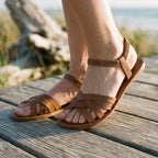 Brown strappy flat sandals with ankle strap and open toe