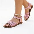 Lavender-pink strappy flat sandals with crisscross straps and open toe