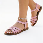 Lavender-pink strappy flat sandals with crisscross straps and open toe