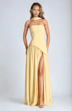 Strapless pale-yellow maxi dress with draped asymmetrical hem and high front slit