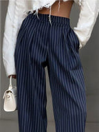 Blue striped high-waisted trousers with elastic waist and vertical stripe pattern