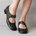 Black Mary Jane shoes with adjustable buckle strap, mary-jane cutout detail