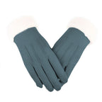 Teal leather gloves with fluffy light cuffs and stitched finger seams