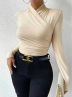 Beige wrap turtleneck top with long sleeves and gathered wrap front