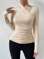 Beige wrap turtleneck top with long sleeves and gathered waist