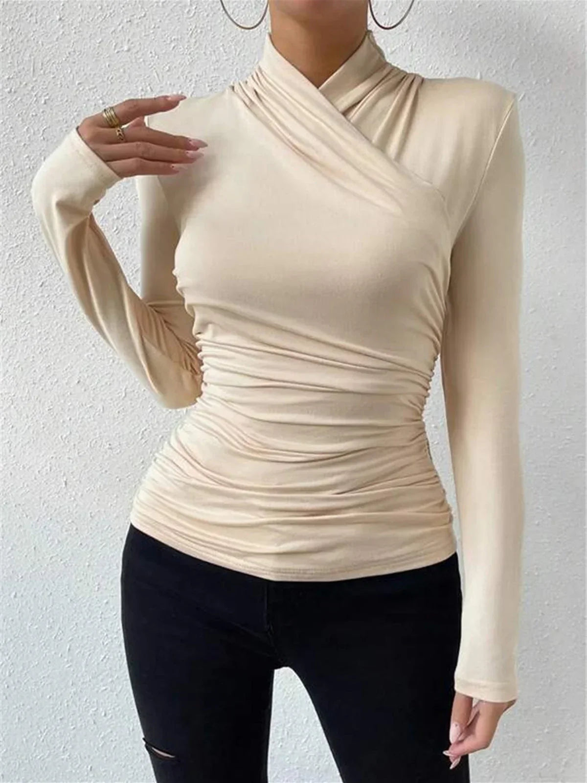 Beige wrap turtleneck top with long sleeves and gathered waist