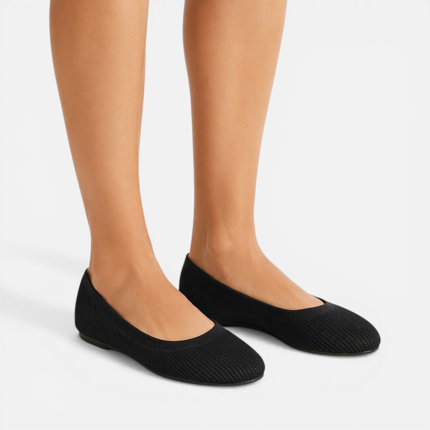 Black knit ballet flats, slip-on style with rounded toe