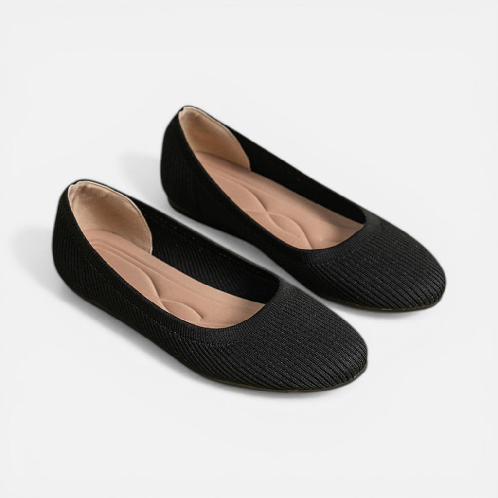Pair of black knit ballet flats with cushioned insole