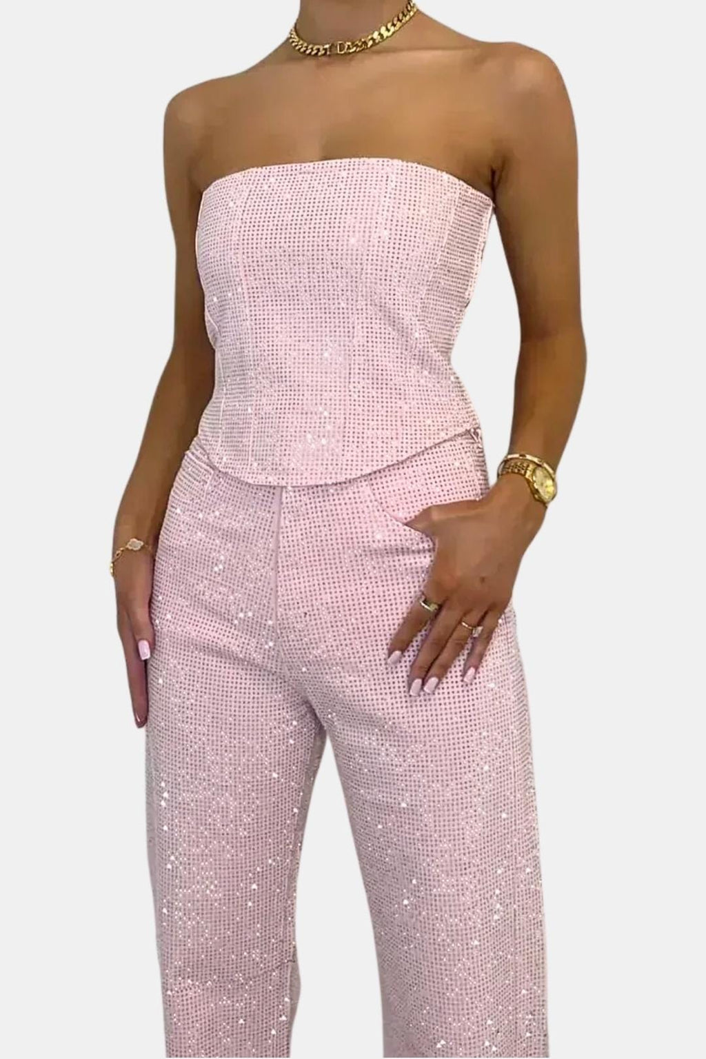 Pink strapless glitter jumpsuit close-up: corset bodice and high-rise waistband