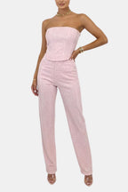 Pink strapless glitter jumpsuit with fitted waist and straight wide pant legs