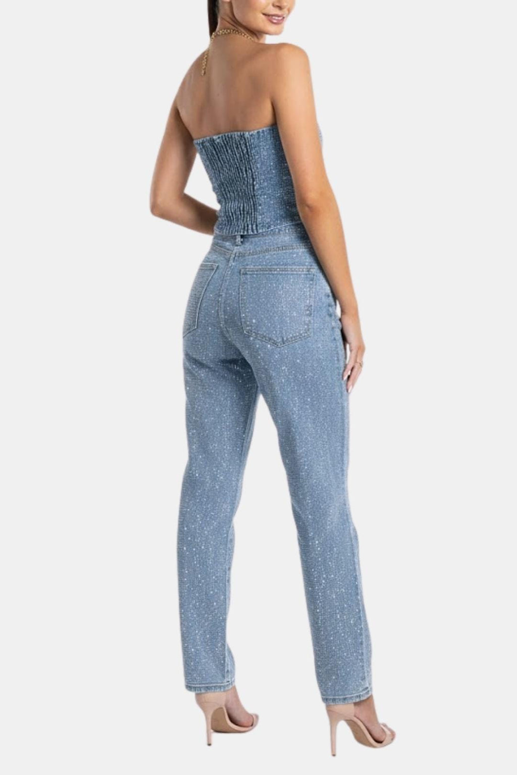 Denim blue strapless glitter jumpsuit with structured bust and high-rise slim legs