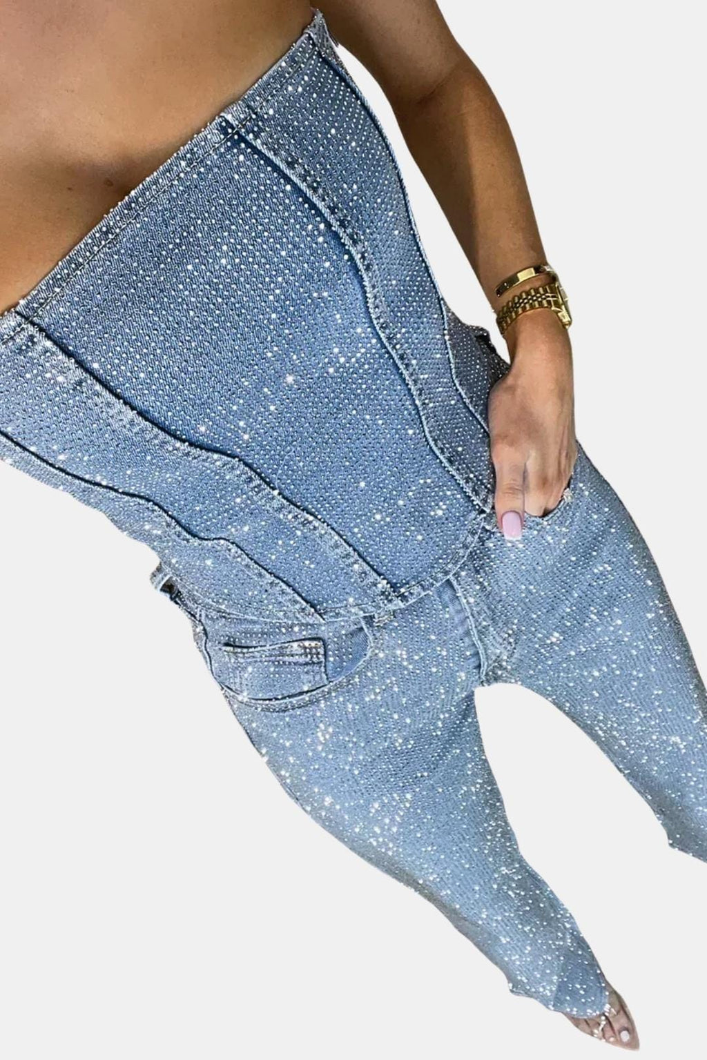 Denim blue strapless glitter jumpsuit close-up: stitched corset bodice and utility pockets