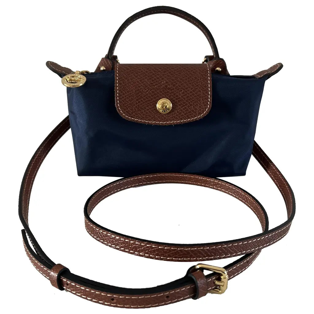 Mini crossbody shoulder bag in dark blue with brown flap and gold-tone front clasp