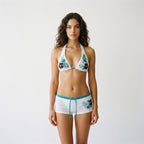 White floral triangle bikini set with teal print and matching drawstring swim shorts