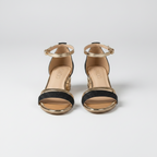 Open-toe sandals with black glitter straps, gold-tone buckles, and low block heels