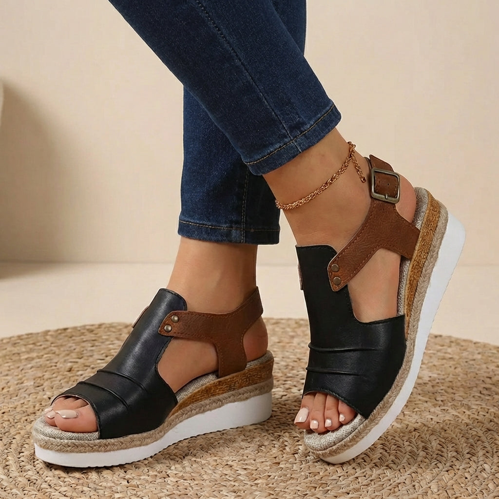Black and brown platform orthopedic sandals with buckled ankle strap and open toe