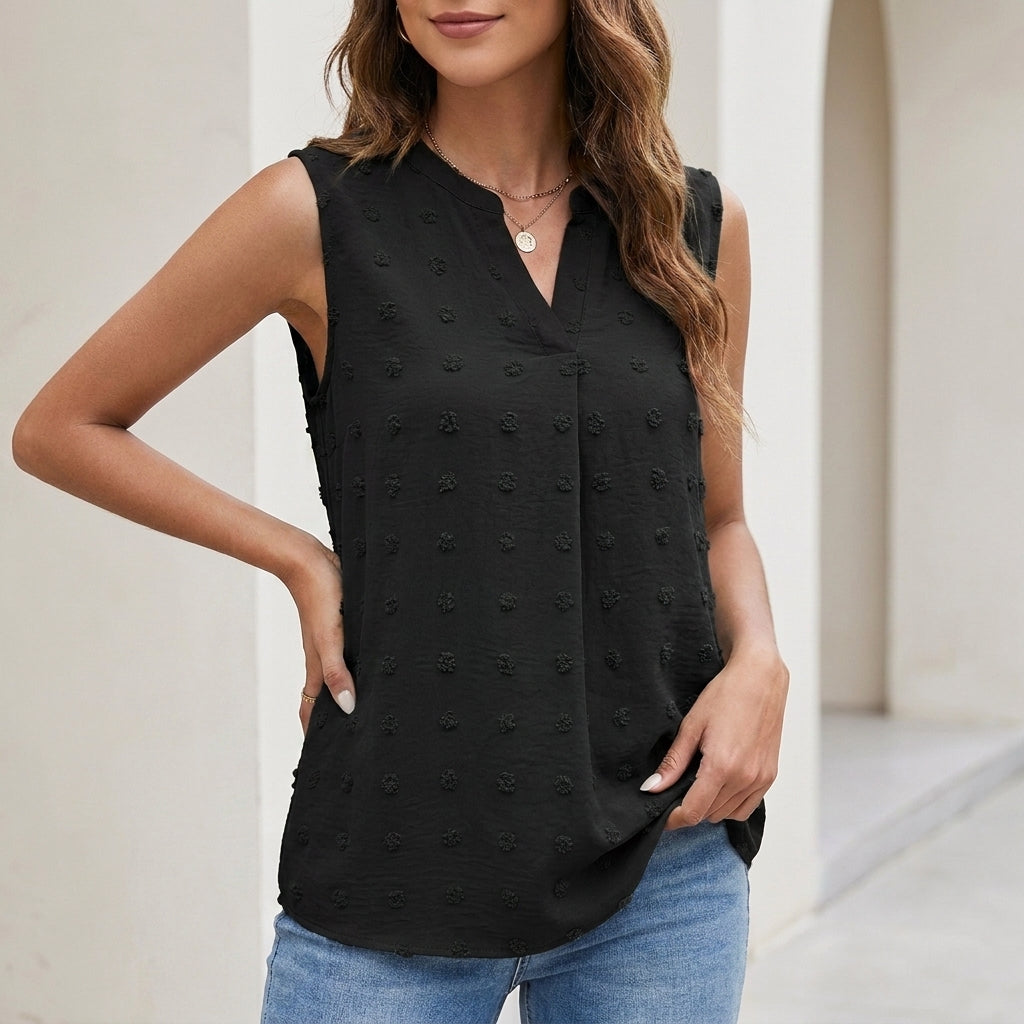 Black sleeveless textured blouse with V-neck and button front