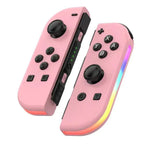 Pink Nintendo Switch RGB LED joy-con controllers with thumbsticks and button layout.