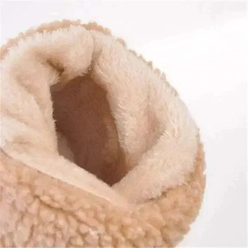 Beige sherpa boot lining interior with visible soft fleece texture