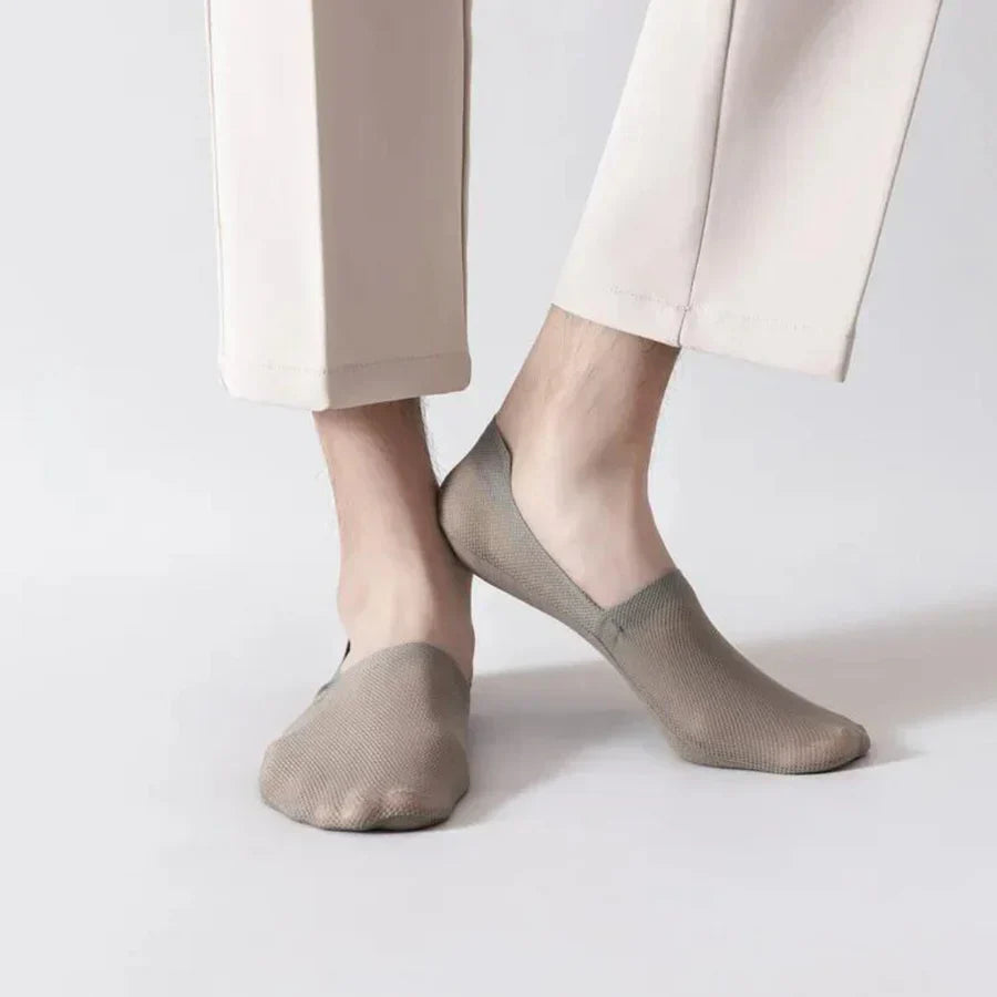 Khaki no-show socks on feet, low-cut ankle style