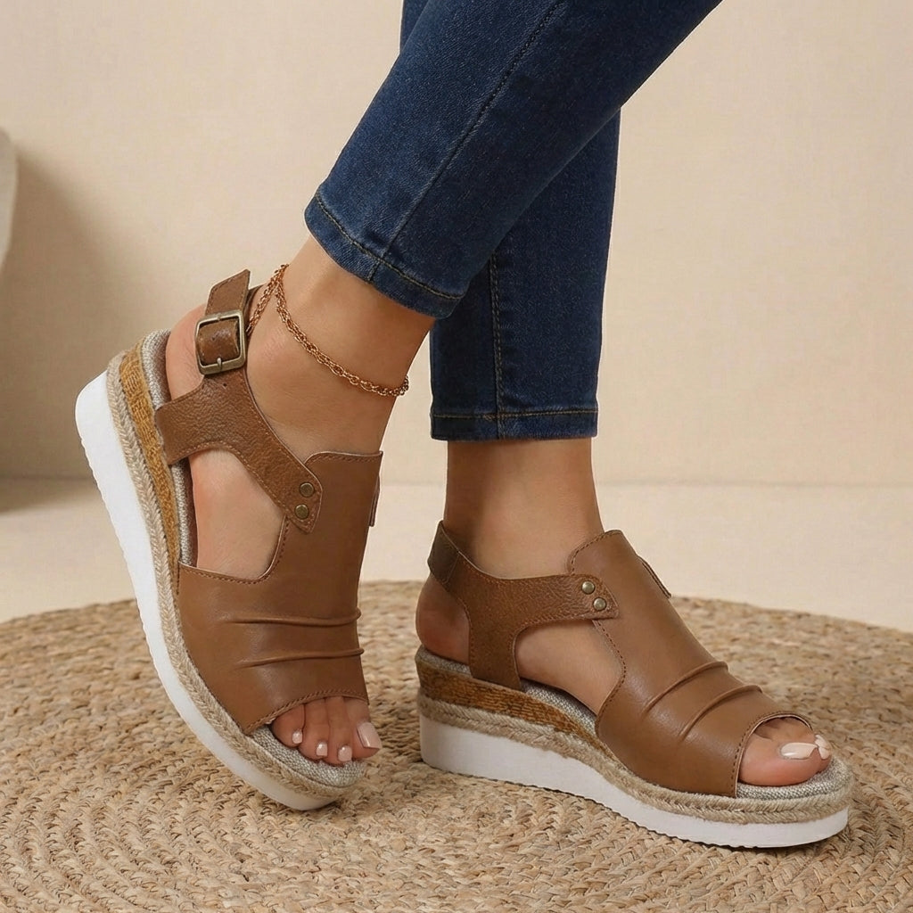 Brown platform orthopedic sandals with buckled ankle strap and open toe