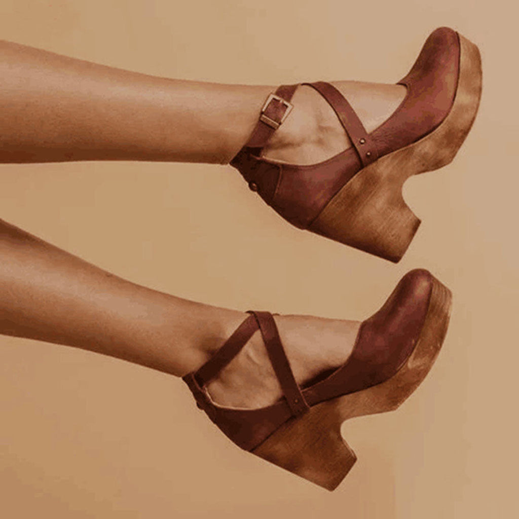 Brown cross-strap Mary Jane platform heels with ankle buckle detail