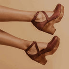 Brown cross-strap Mary Jane platform heels with ankle buckle detail