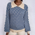 Blue patterned knitted sweater with cream collar and button front, ribbed hem