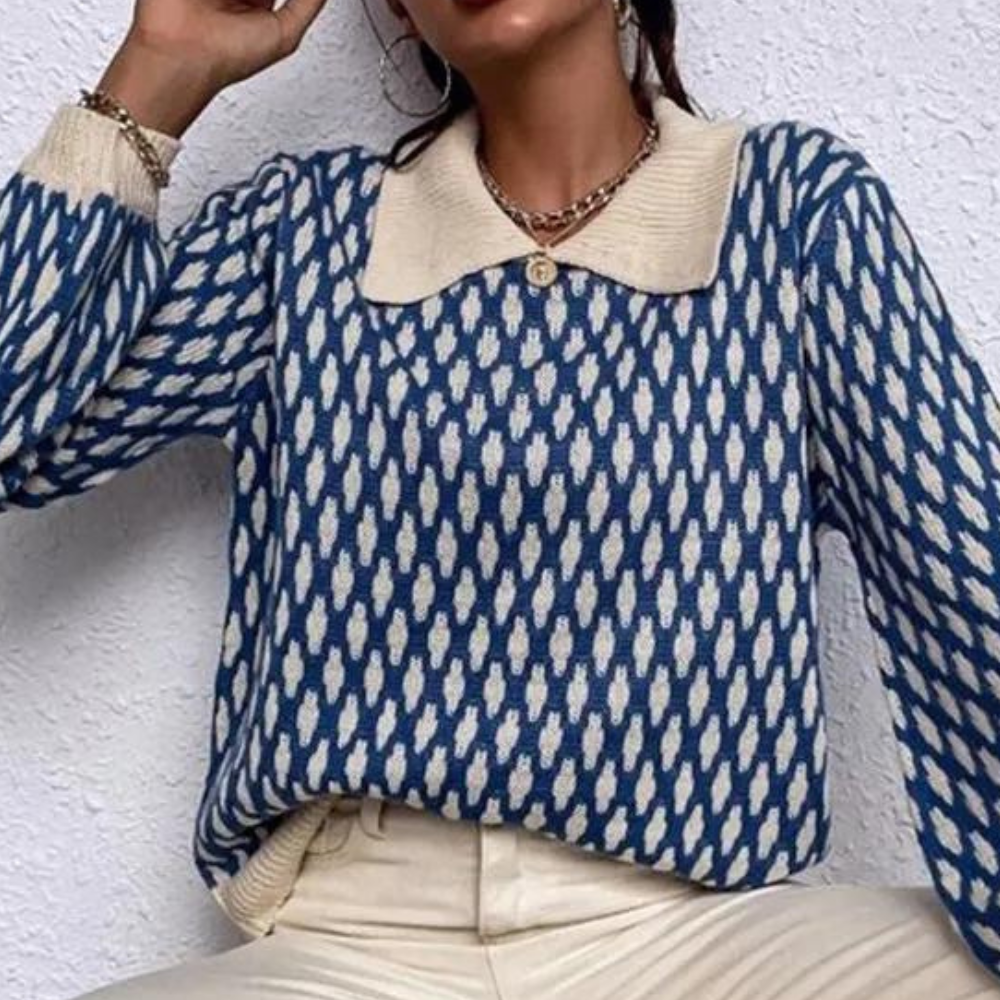 Blue patterned knitted sweater with cream collar and gold button, long sleeves