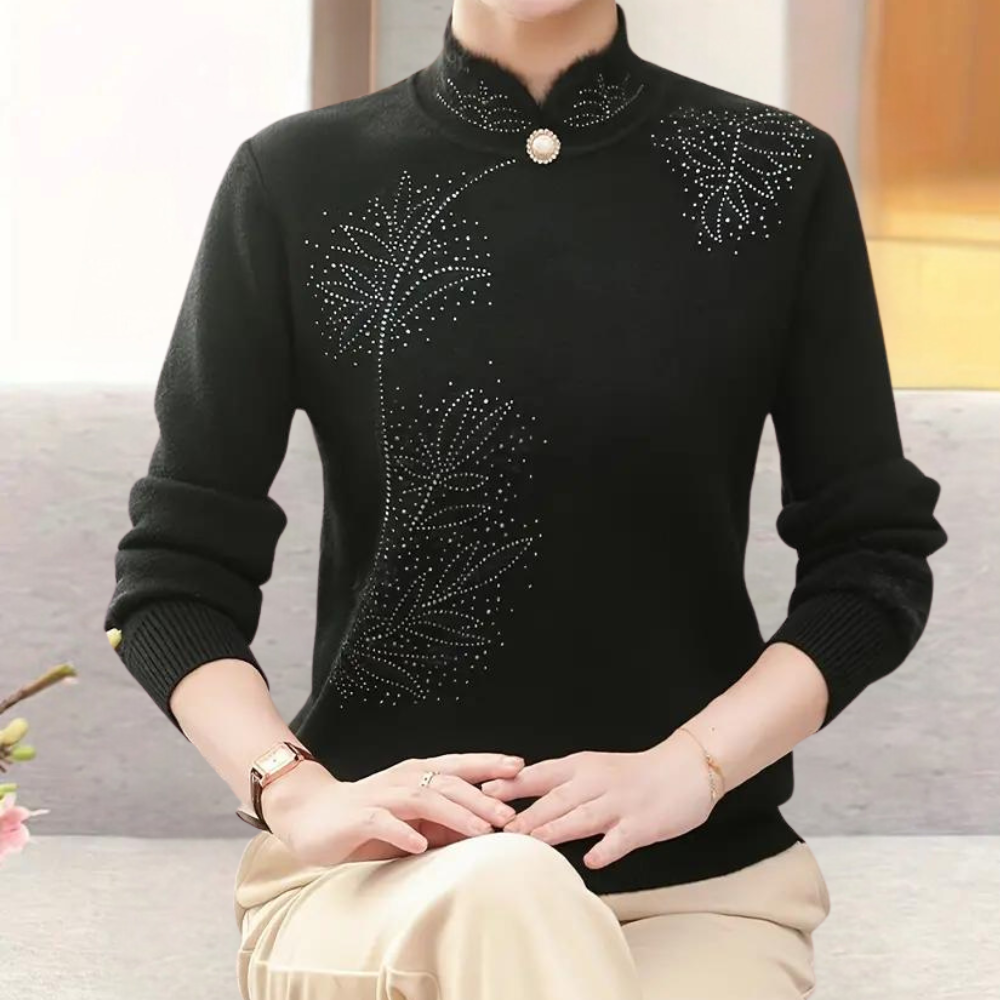 Alfhild black knit sweater with high collar, studded floral pattern, button